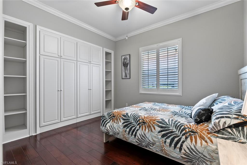 6051 Shallows Way Naples, FL 34109 - Photo 31 of 38 a bedroom with a bed and a window
