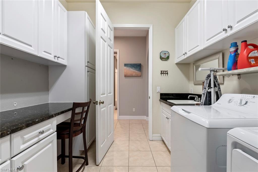 6051 Shallows Way Naples, FL 34109 - Photo 32 of 38 a utility room with dryer and washer