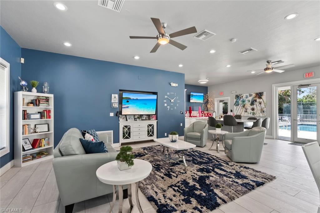 6051 Shallows Way Naples, FL 34109 - Photo 37 of 38 a living room with furniture and a wooden floor