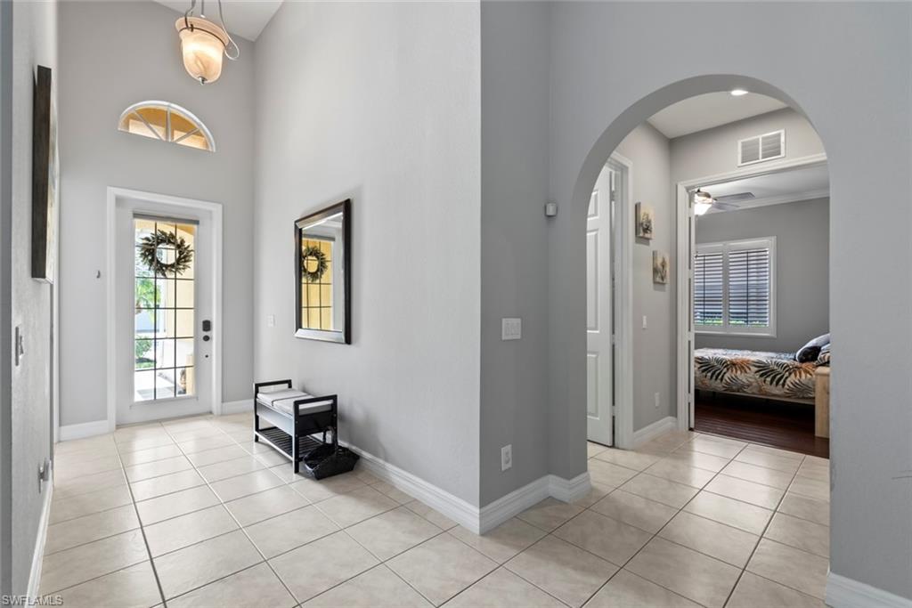 6051 Shallows Way Naples, FL 34109 - Photo 4 of 38 a view of a livingroom with furniture and windows