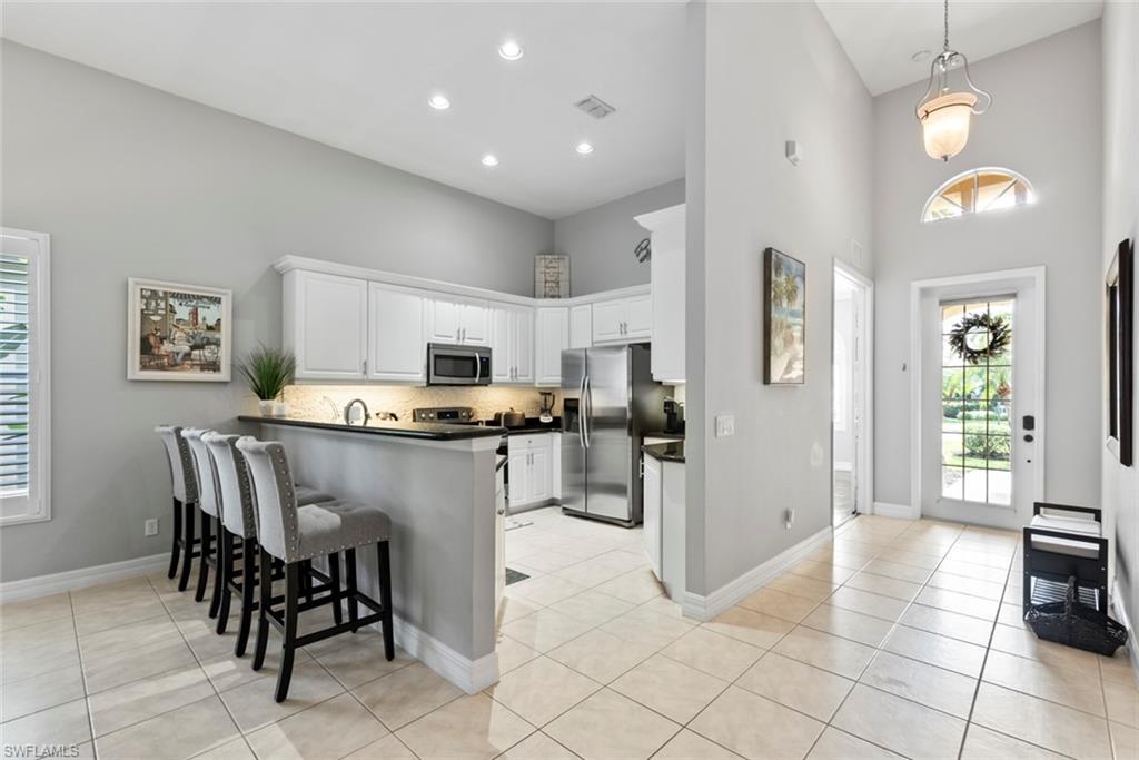 6051 Shallows Way Naples, FL 34109 - Photo 5 of 38 a view of a dining room kitchen and a window