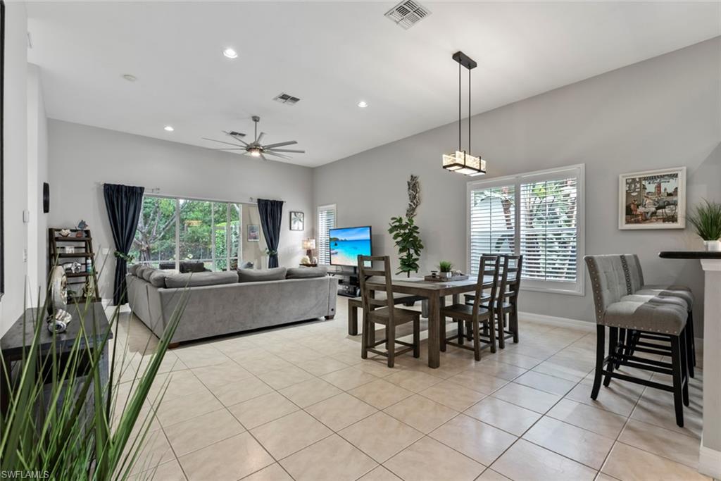6051 Shallows Way Naples, FL 34109 - Photo 7 of 38 a view of a dining room with furniture