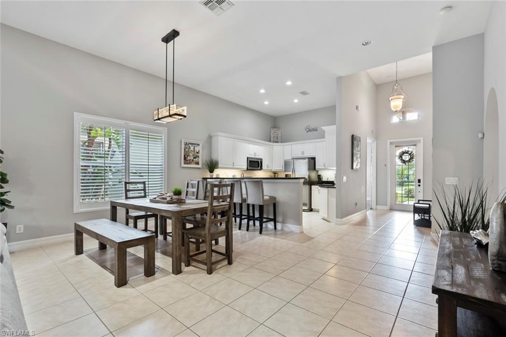6051 Shallows Way Naples, FL 34109 - Photo 9 of 38 a view of a dining room and livingroom view