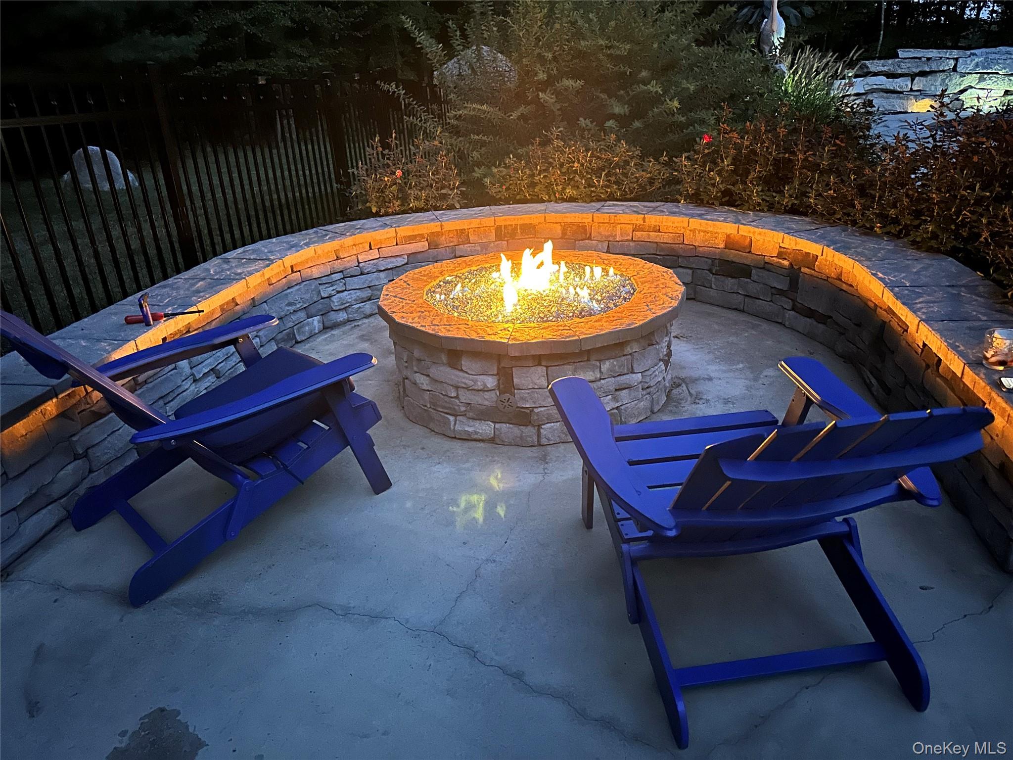 95 Weed Road Pine Bush, NY 12566 - Photo 28 of 31 Outdoor patio featuring a stone gas fire pit with a decorative glass media bed