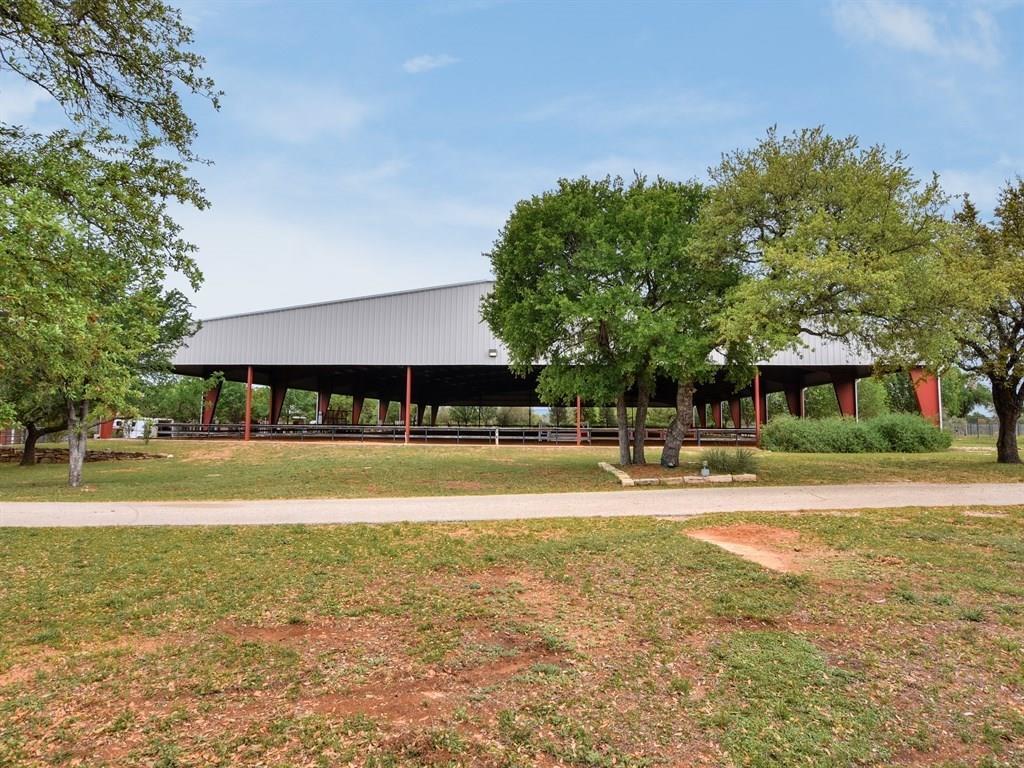 3307 Sunset Cliff Road Burnet, TX 78611 - Photo 13 of 23 a view of swimming pool with lawn chairs and large trees