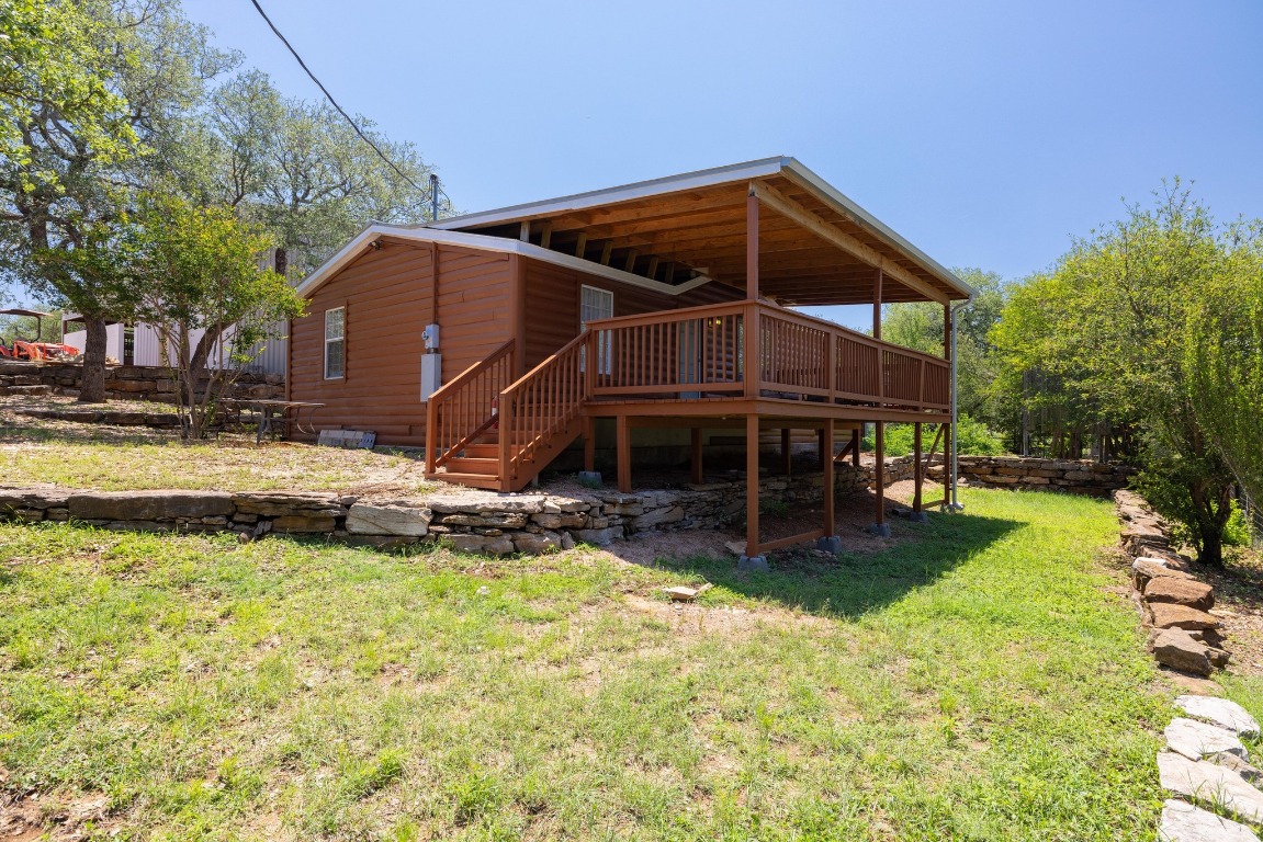 3307 Sunset Cliff Road Burnet, TX 78611 - Photo 15 of 23 a view of a house with backyard and sitting area