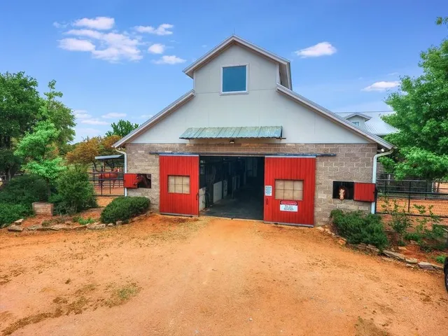 a front view of a house with yard and garage