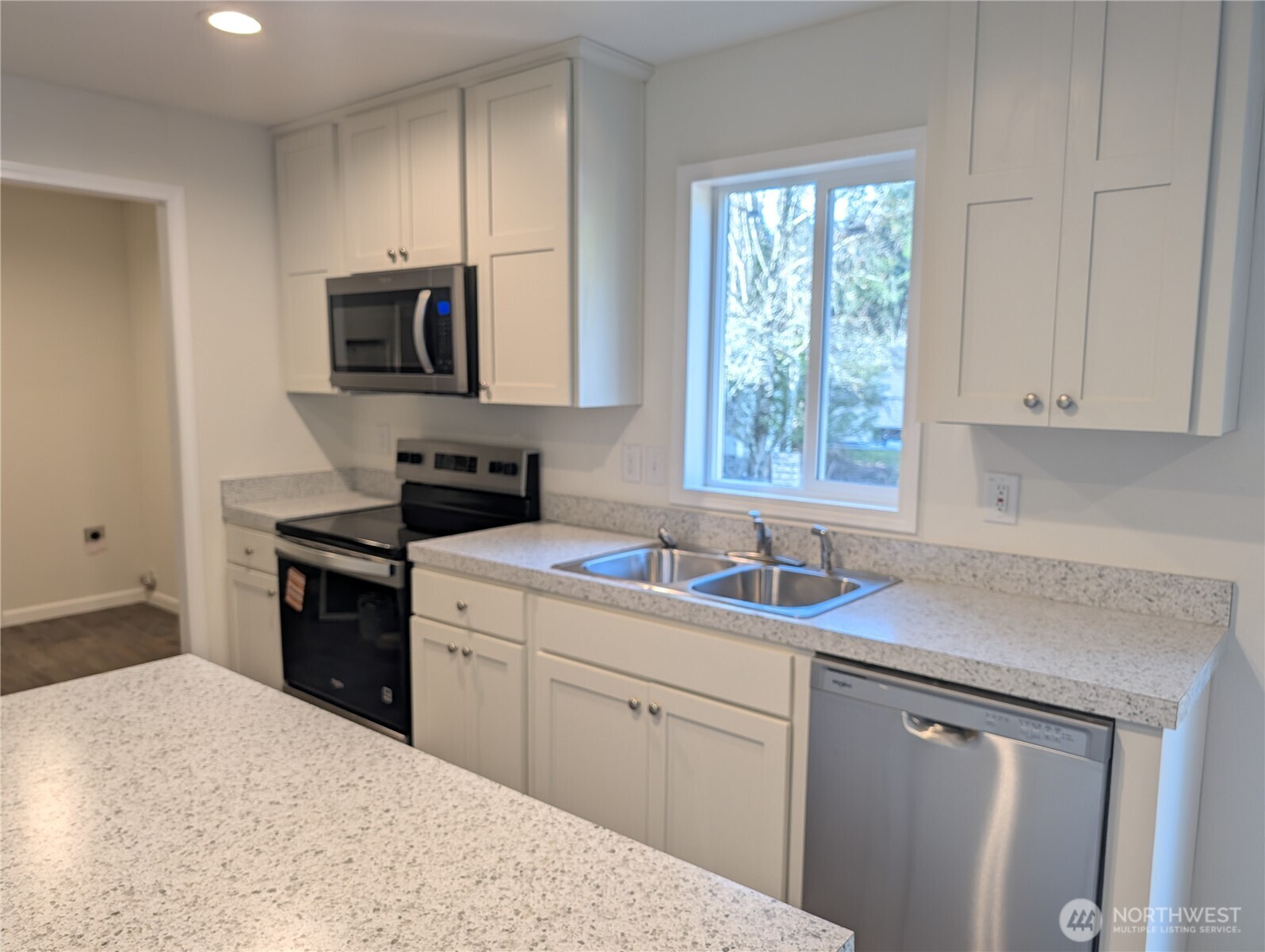 4000 Flynn Street, Unit 33 Bellingham, WA 98229 - Photo 6 of 15 a kitchen with a sink stove and microwave
