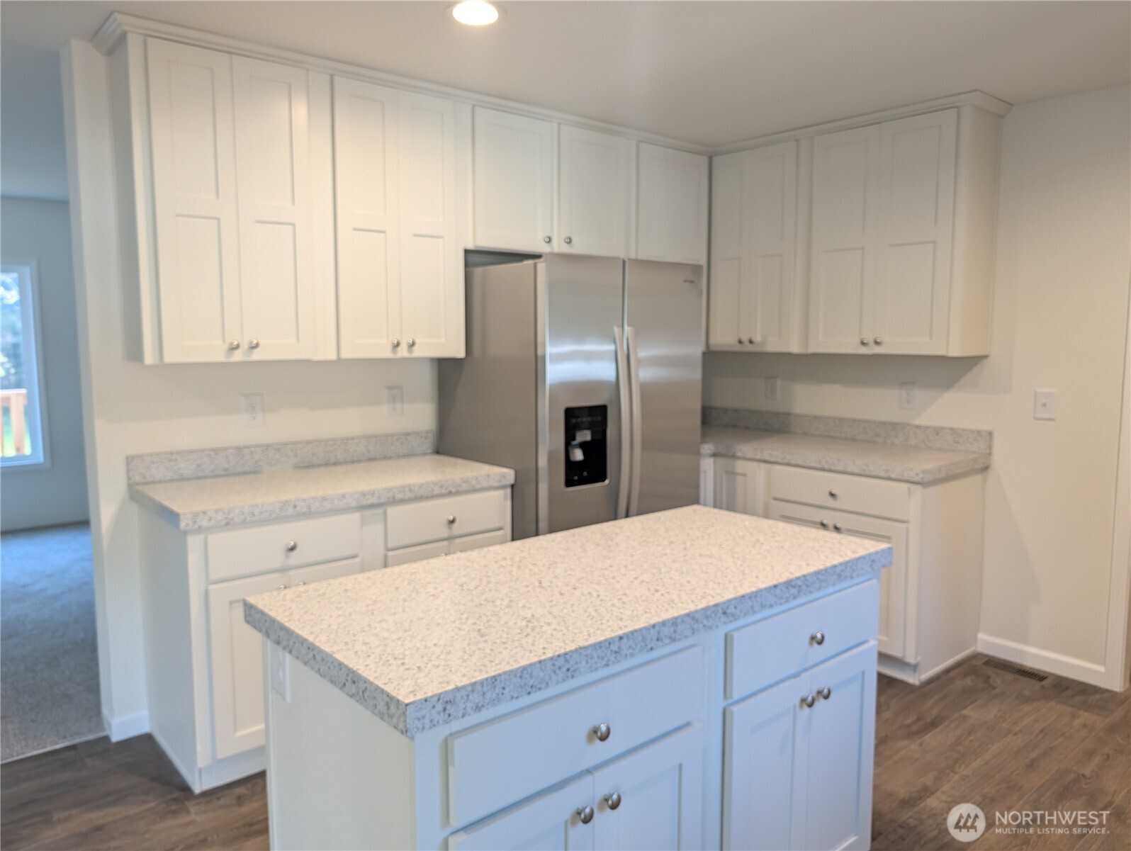 4000 Flynn Street, Unit 33 Bellingham, WA 98229 - Photo 7 of 15 a kitchen with a sink a refrigerator and cabinets