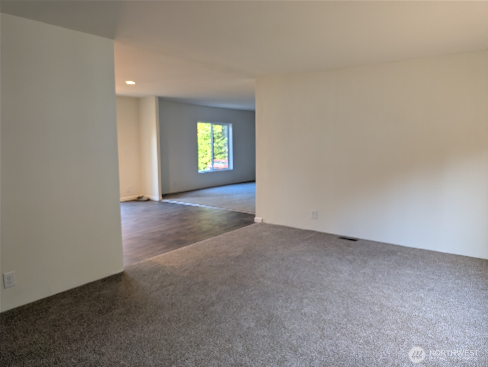 4000 Flynn Street, Unit 33 Bellingham, WA 98229 - Photo 9 of 15 an empty room with a window and a fireplace