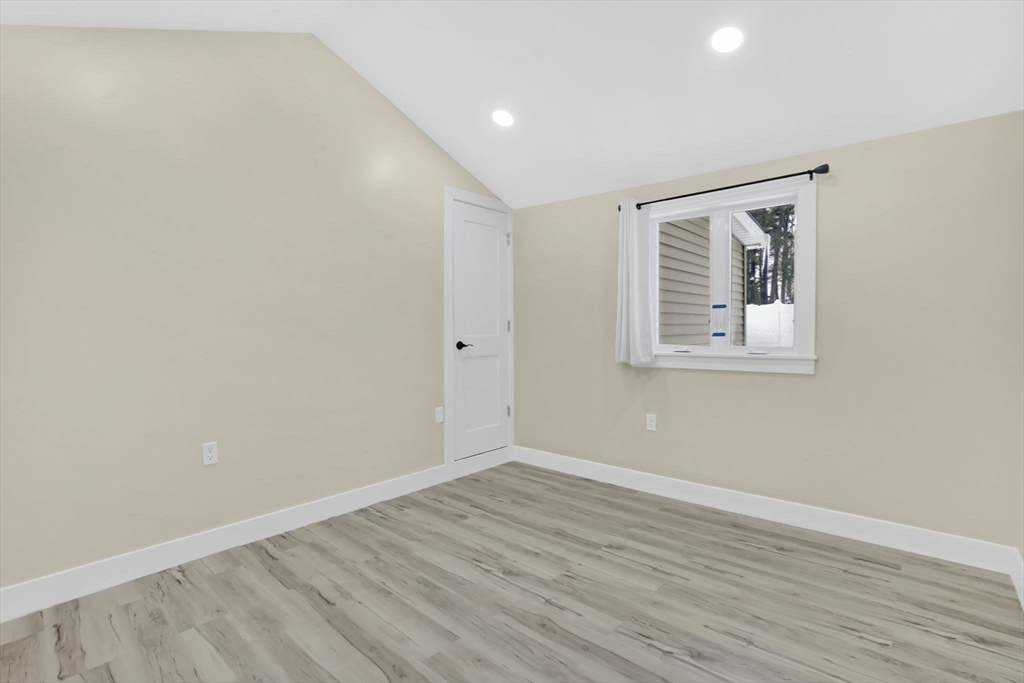 288 Buck Pond Road Westfield, MA 01085 - Photo 17 of 38 a view of room with window and wooden floor
