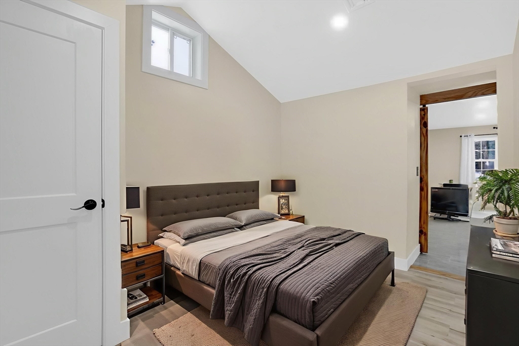 288 Buck Pond Road Westfield, MA 01085 - Photo 22 of 38 a bedroom with a bed and wooden floor