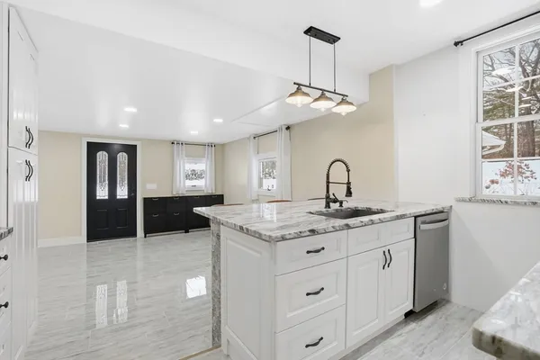 a kitchen with a counter space cabinets and appliances