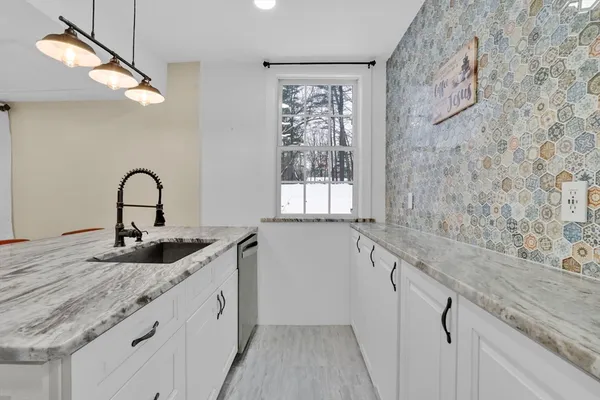 a kitchen with a sink and a window
