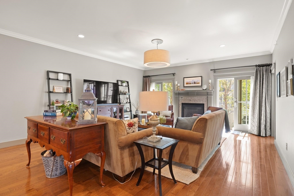 14 Parkview Road, Unit 14 Franklin, MA 02038 - Photo 12 of 42 a living room with fireplace furniture and a wooden floor