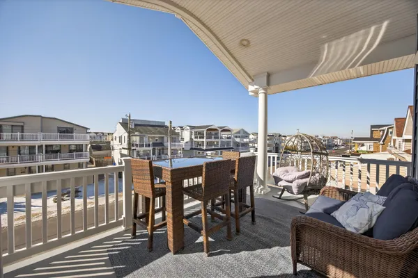 a view of a balcony with furniture