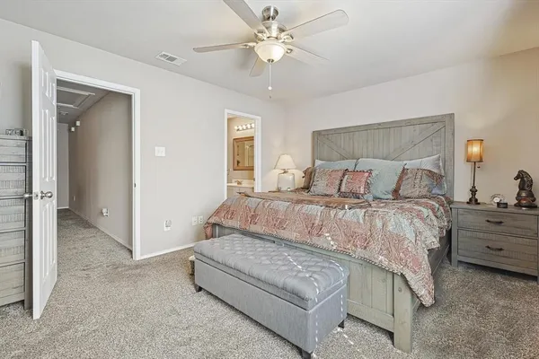 a bedroom with bed and window
