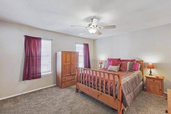 a bedroom with a bed and window