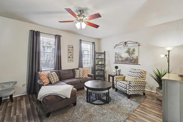 a living room with furniture and a large window