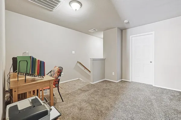 a workspace with furniture and window