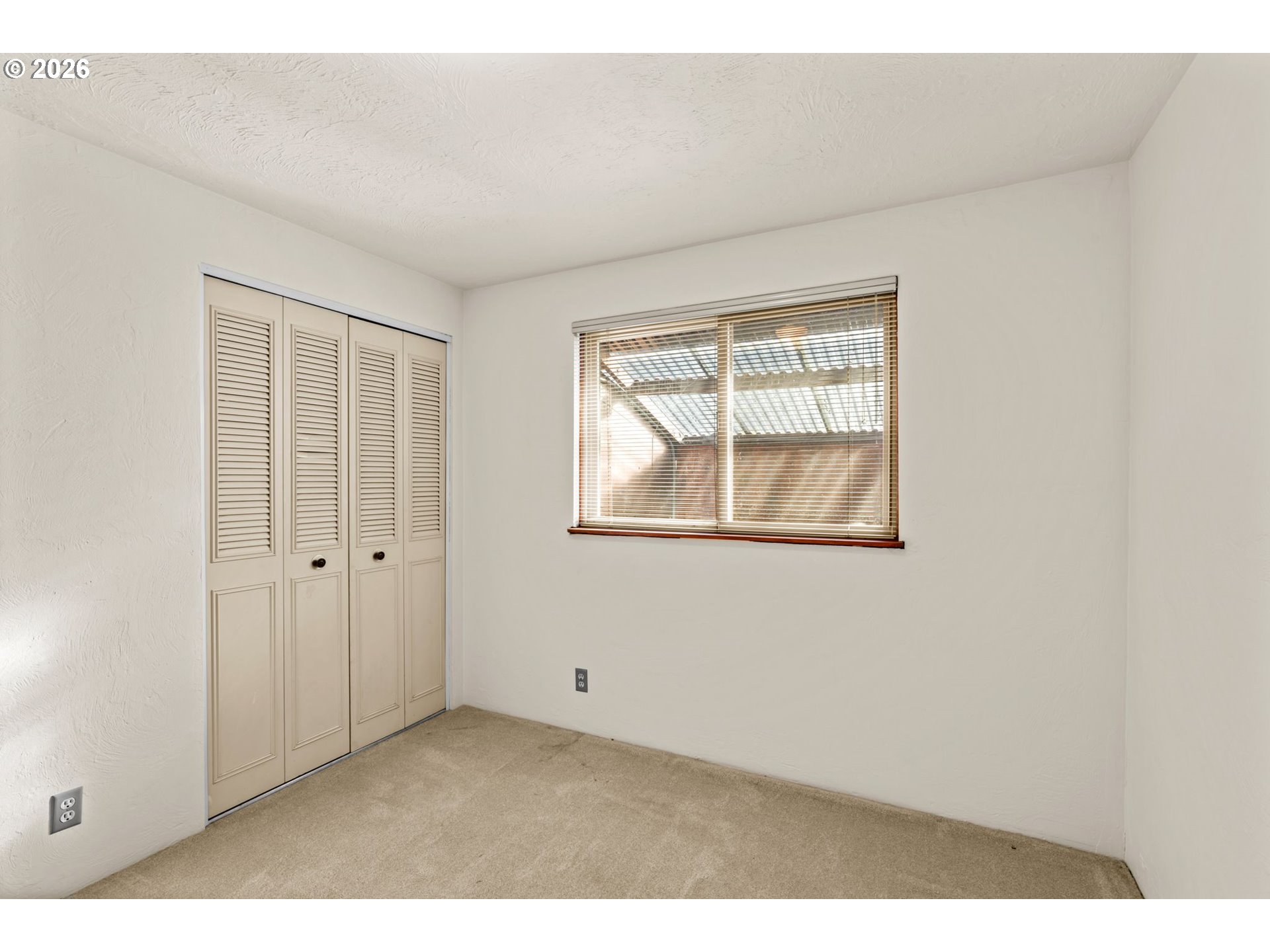 1625 South Bertelsen Road Eugene, OR 97402 - Photo 16 of 34 a view of an empty room with a window