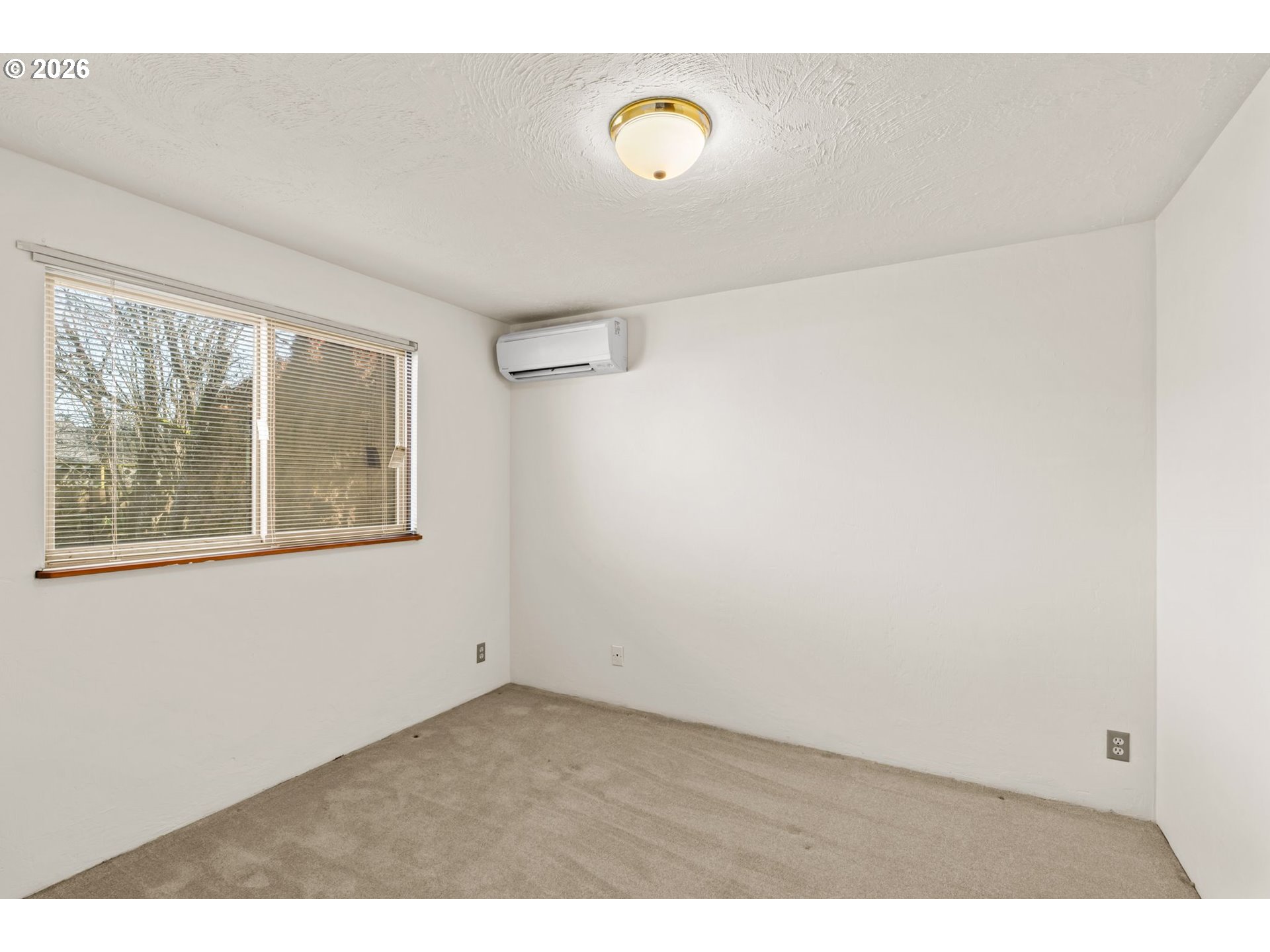 1625 South Bertelsen Road Eugene, OR 97402 - Photo 17 of 34 a view of an empty room with a window