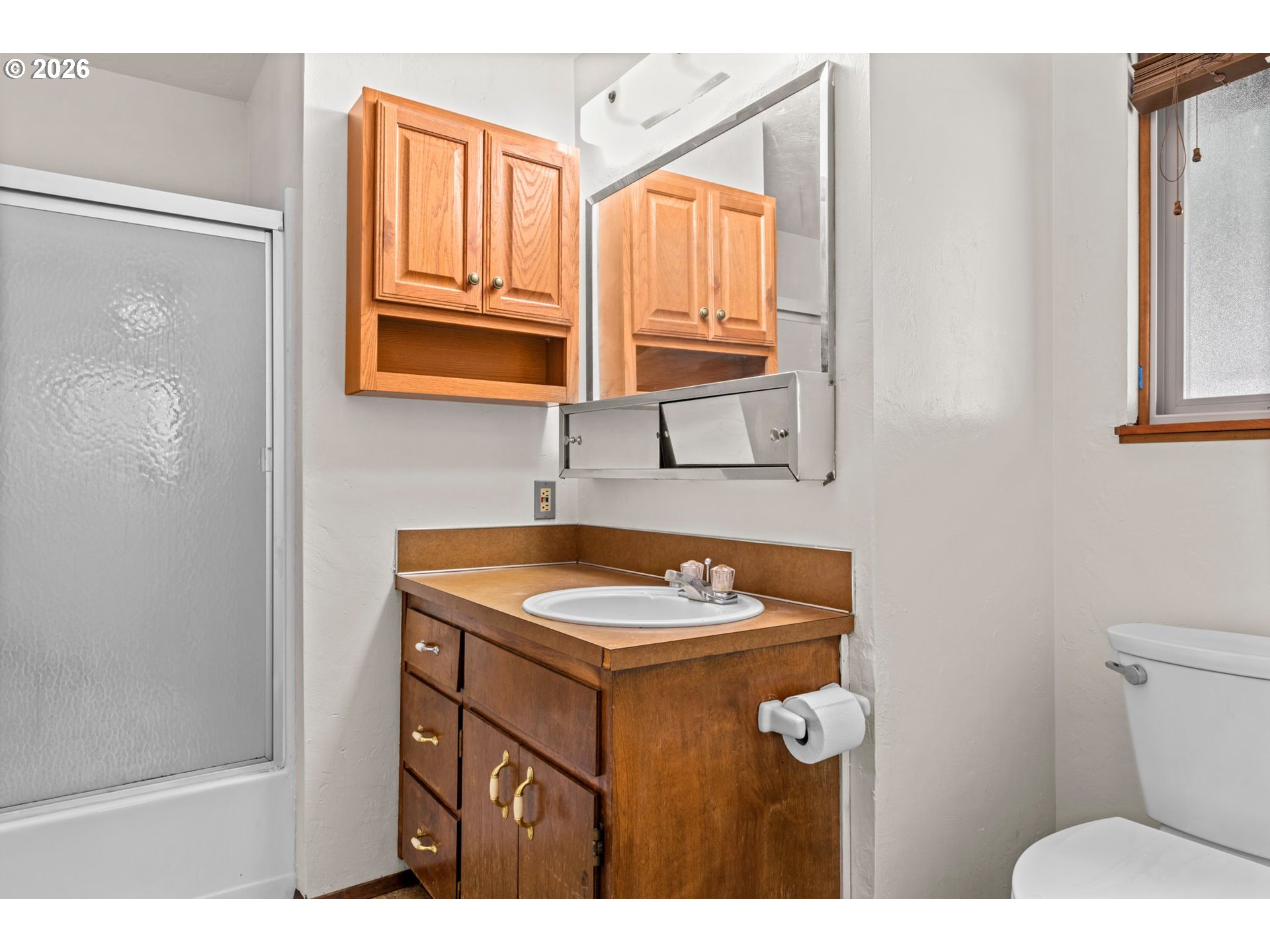1625 South Bertelsen Road Eugene, OR 97402 - Photo 21 of 34 a bathroom with a sink toilet and mirror