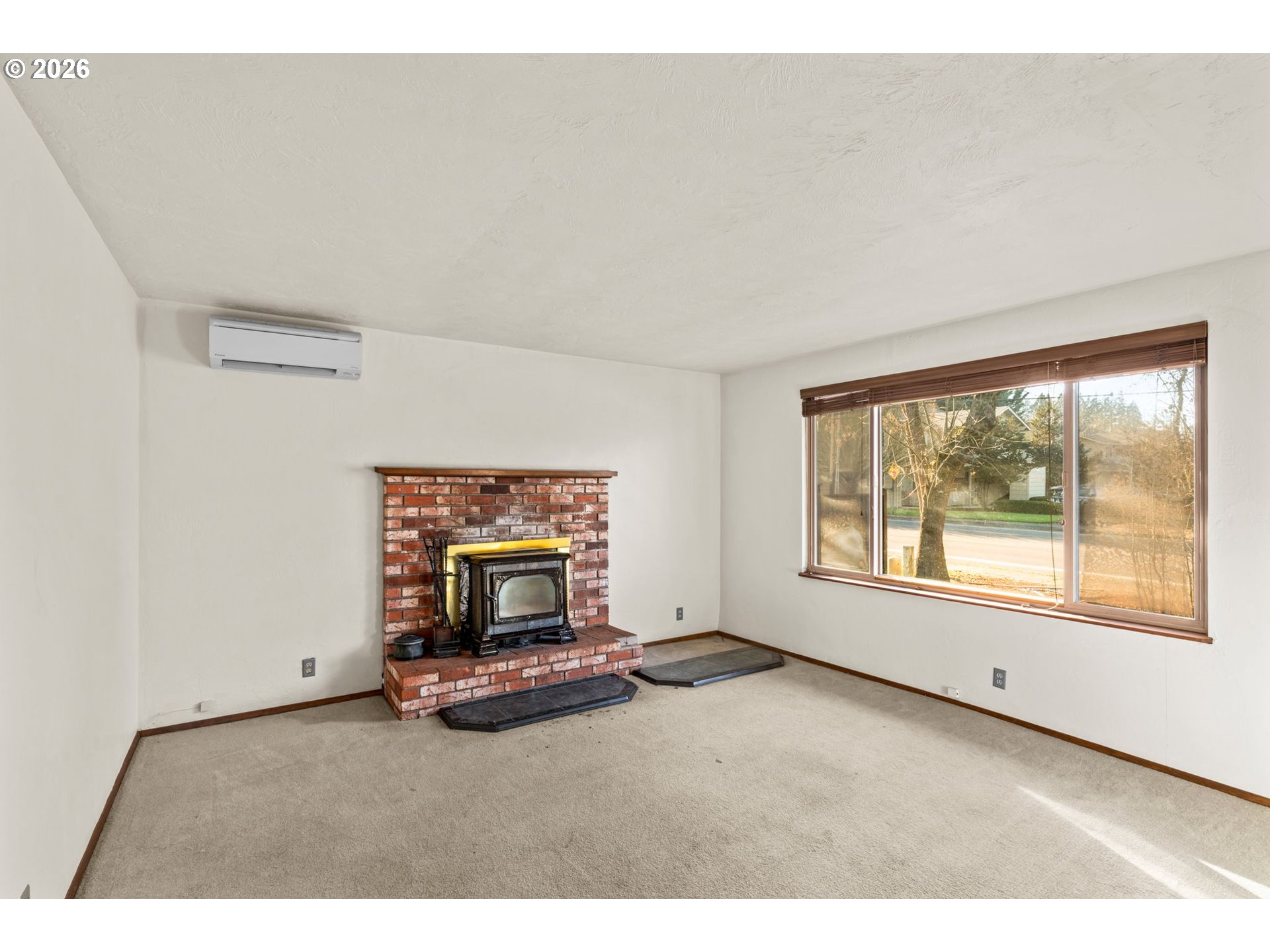 1625 South Bertelsen Road Eugene, OR 97402 - Photo 7 of 34 a living room with furniture and a fireplace