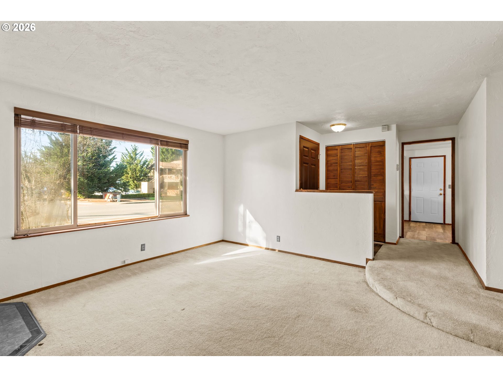 1625 South Bertelsen Road Eugene, OR 97402 - Photo 9 of 34 a view of an empty room with a window