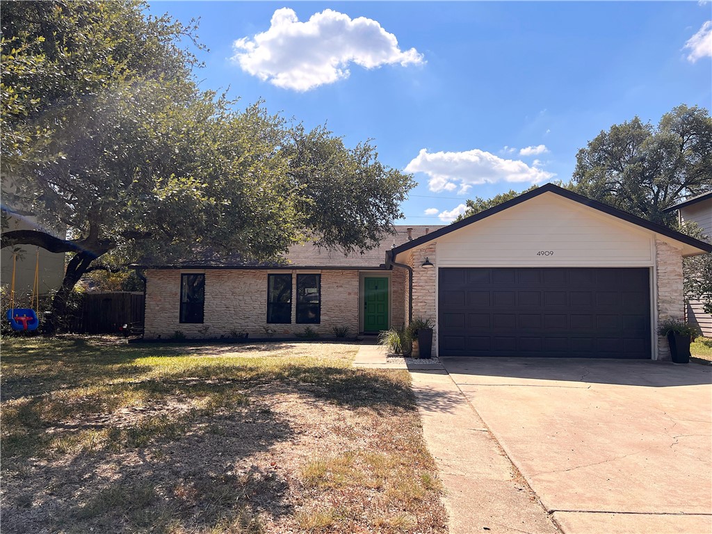 4909 Wing Road Austin, TX 78749 - Photo 1 of 1 a front view of house with yard and trees