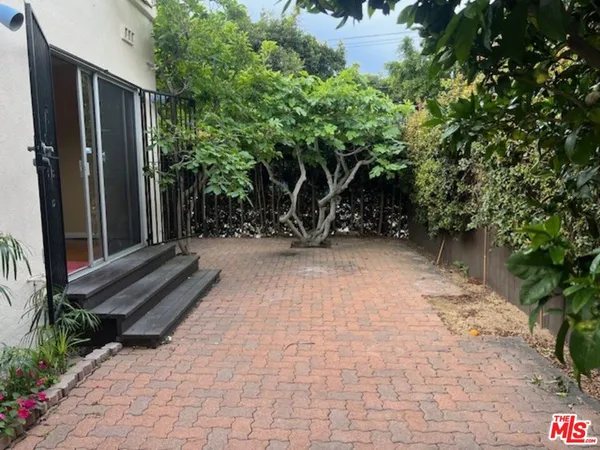 a view of a pathway with a wooden fence