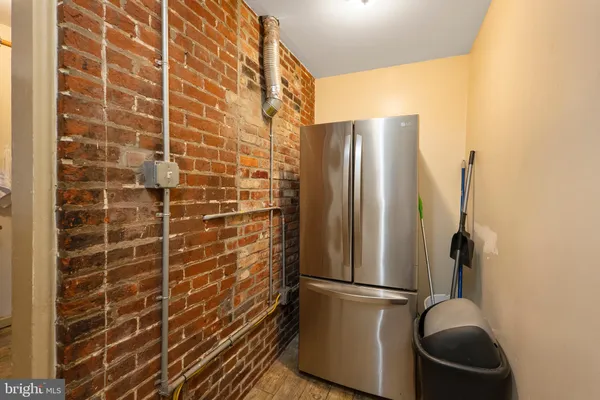 a bathroom with a shower and a mirror
