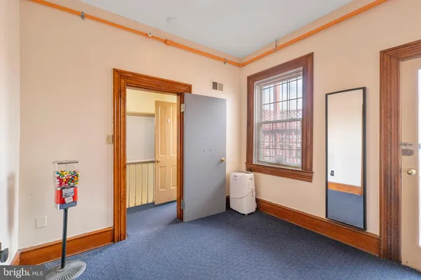 a view of an empty room and window