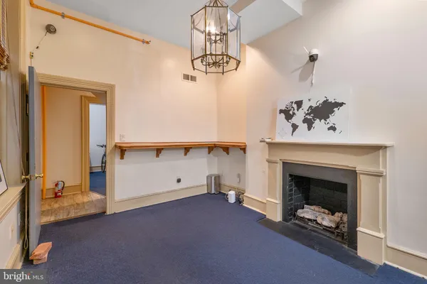 a view of livingroom with furniture and chandelier