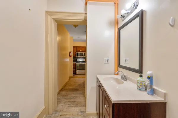 a bathroom with a sink and a mirror