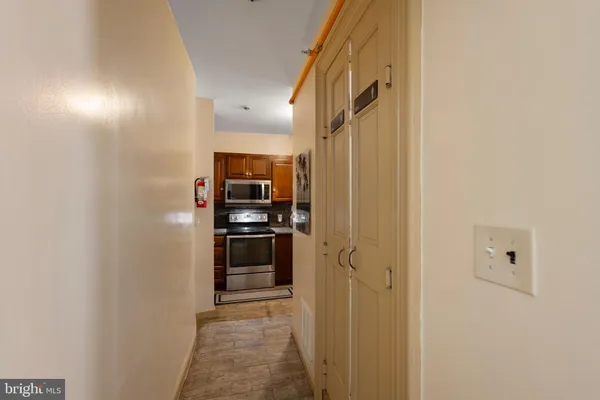 a kitchen with cabinets and stainless steel appliances