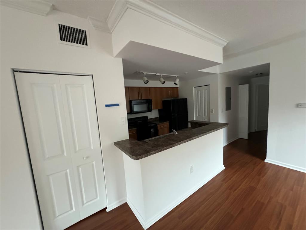 5800 West Sample Road, Unit 2011 Coral Springs, FL 33067 - Photo 16 of 25 a living room with stainless steel appliances furniture and a refrigerator