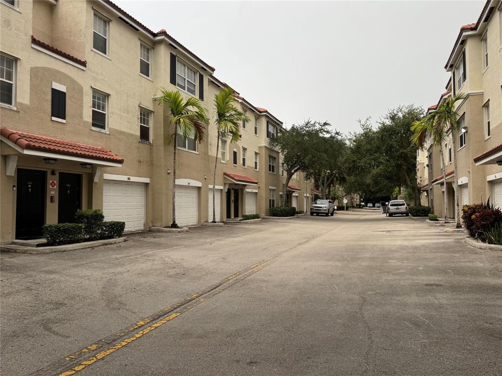 5800 West Sample Road, Unit 2011 Coral Springs, FL 33067 - Photo 2 of 25 a view of a street with a building in the background