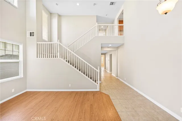 a view of staircase with white walls and a window