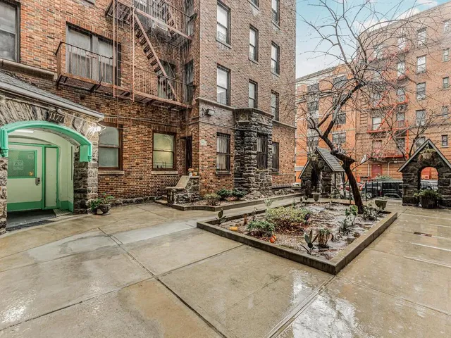 a view of a street with large trees