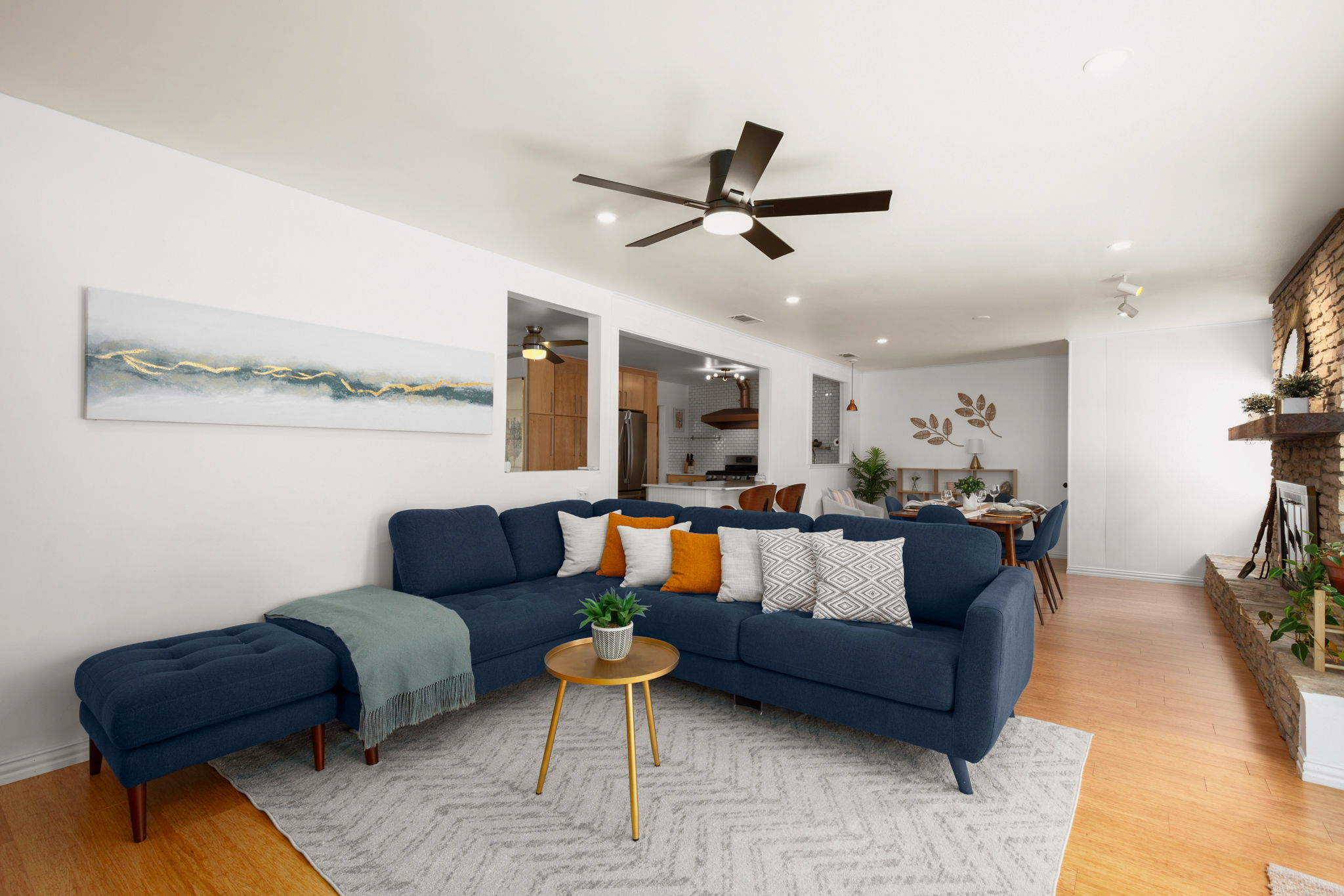 6304 Peggy Street Austin, TX 78723 - Photo 15 of 35 Living room featuring light wood-style flooring, ceiling fan, recessed lighting, and a fireplace