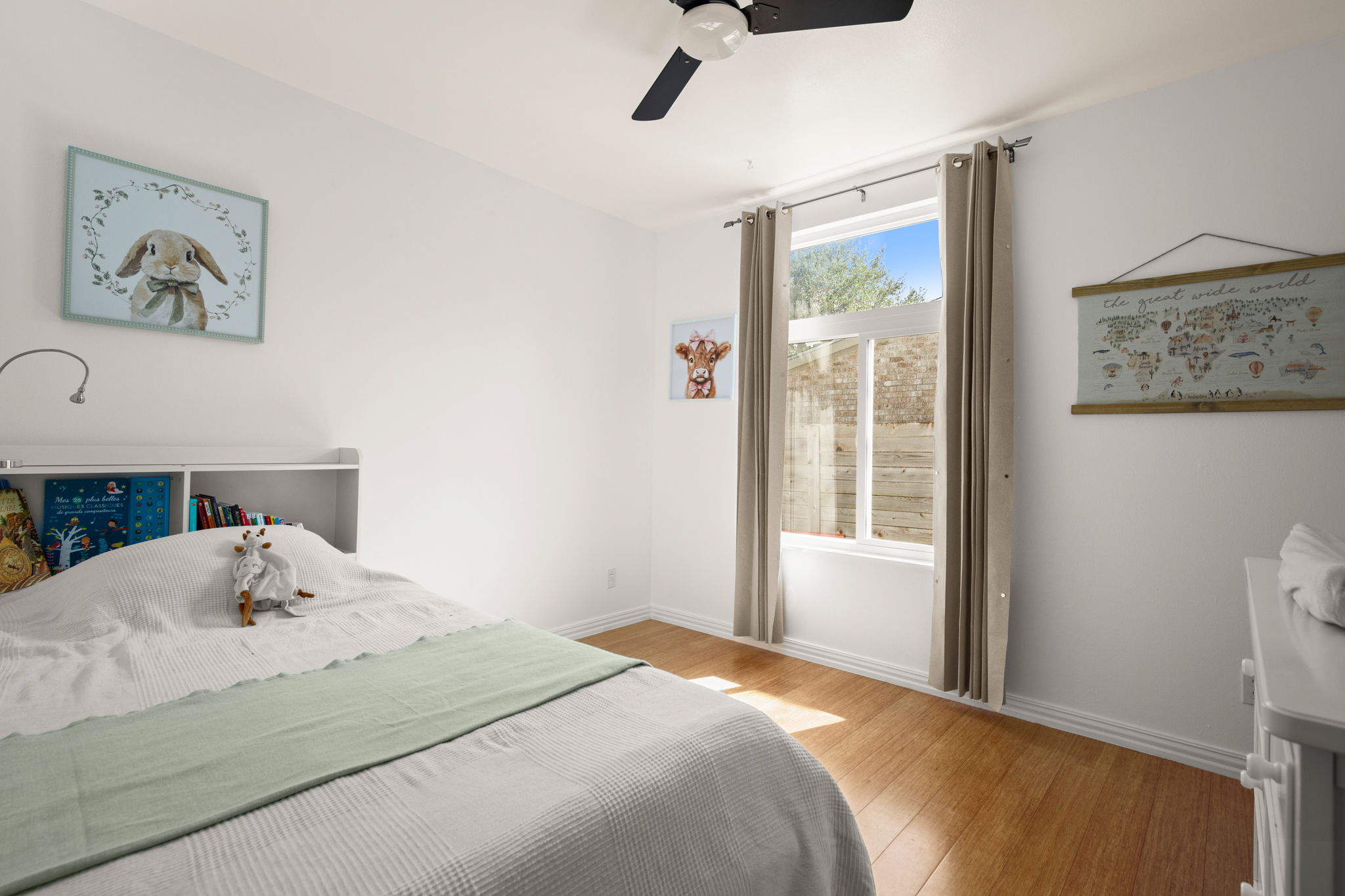 6304 Peggy Street Austin, TX 78723 - Photo 16 of 35 Bedroom featuring ceiling fan and light wood-style flooring