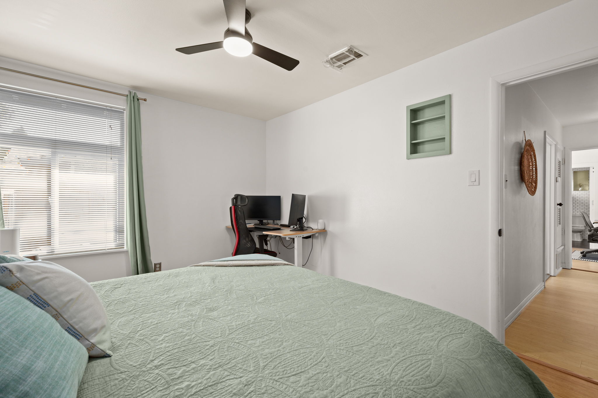 6304 Peggy Street Austin, TX 78723 - Photo 18 of 35 Bedroom featuring ceiling fan and wood finished floors
