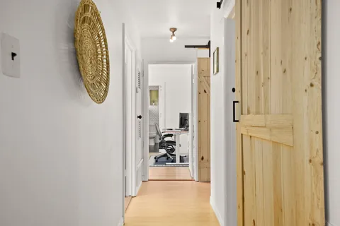 a view of a hallway with windows