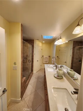 a dining hall with granite countertop a sink and cabinets