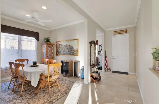 a view of a livingroom with furniture and a window