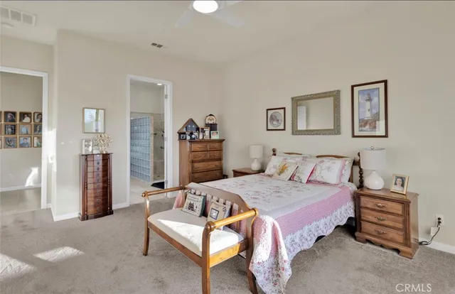 a bedroom with a bed and a table