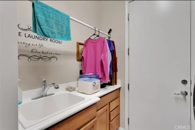 a bathroom with a sink vanity and a mirror