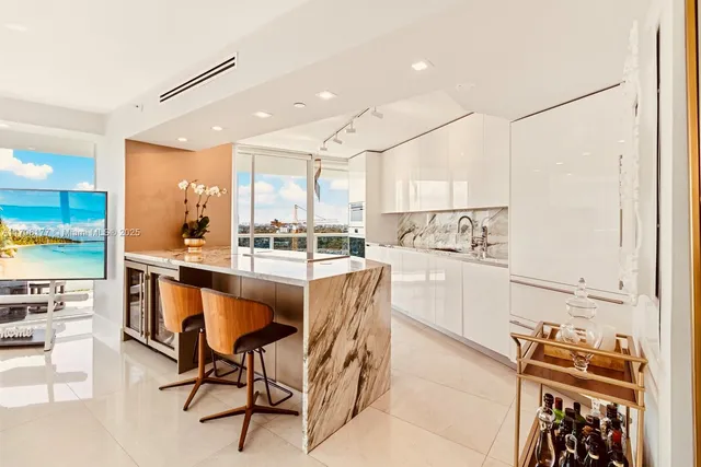 a kitchen with stainless steel appliances kitchen island wooden cabinets and stove
