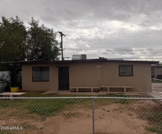 a view of a backyard of the house